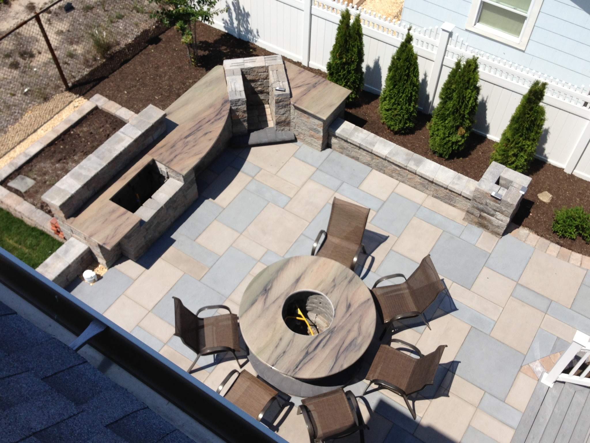 backyard patio with outdoor kitchen from CKC Landscaping