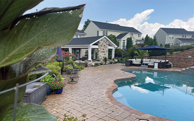 backyard with pool and two seating areas from CKC Landscaping