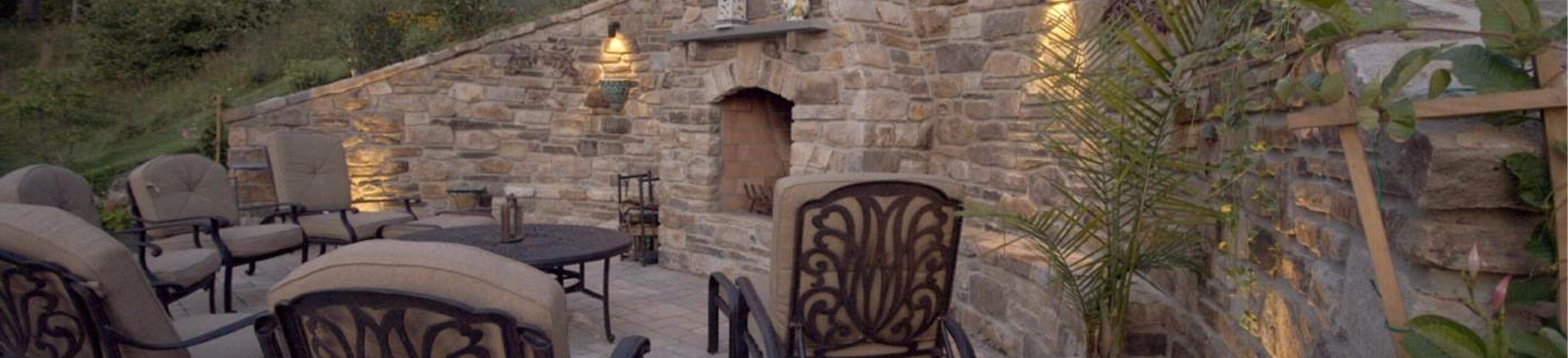 Outdoor patio area with seating and fire pit from CKC Landscaping