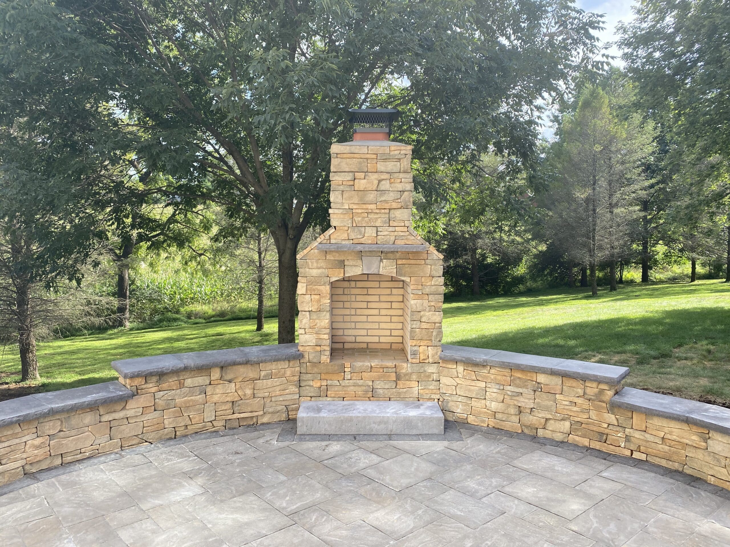 Retaining wall with fireplace from CKC landscaping