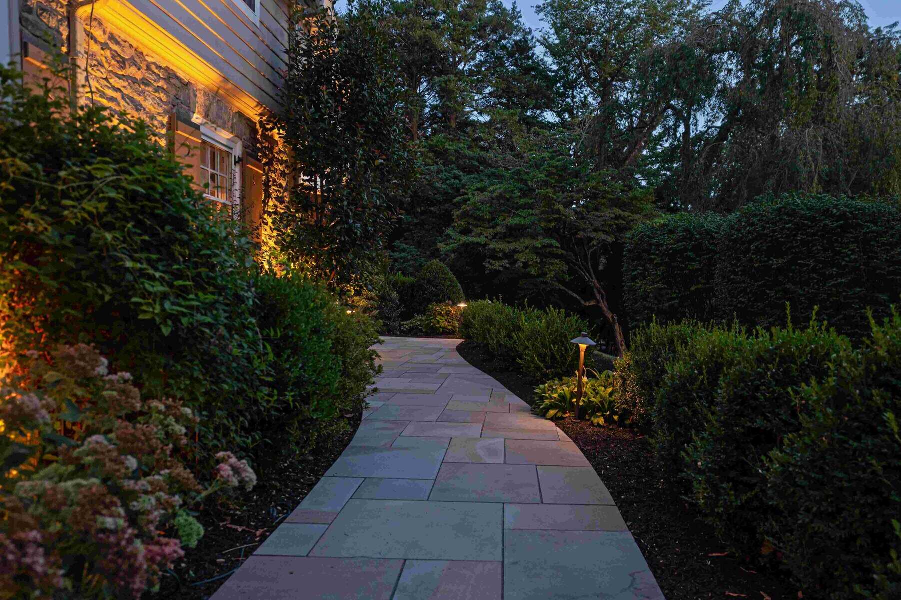 LED path lights illuminating paver walkway at night in Downingtown