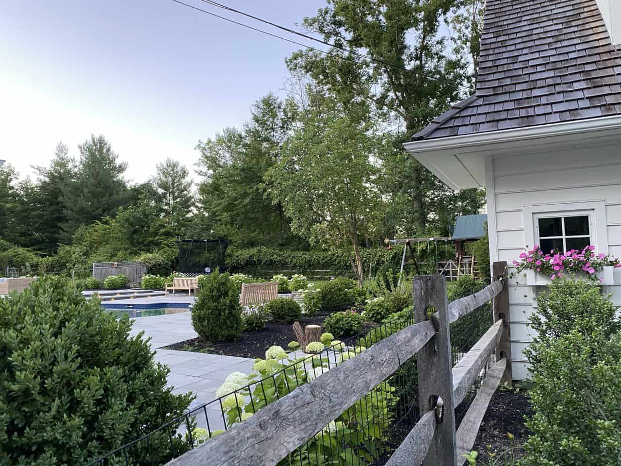 Modern-Pool-Patio-Paver-Installation-Newtown-Square Techo-Bloc Travertina pool deck installation with coping and lounge area in Newtown Square Pennsylvania.