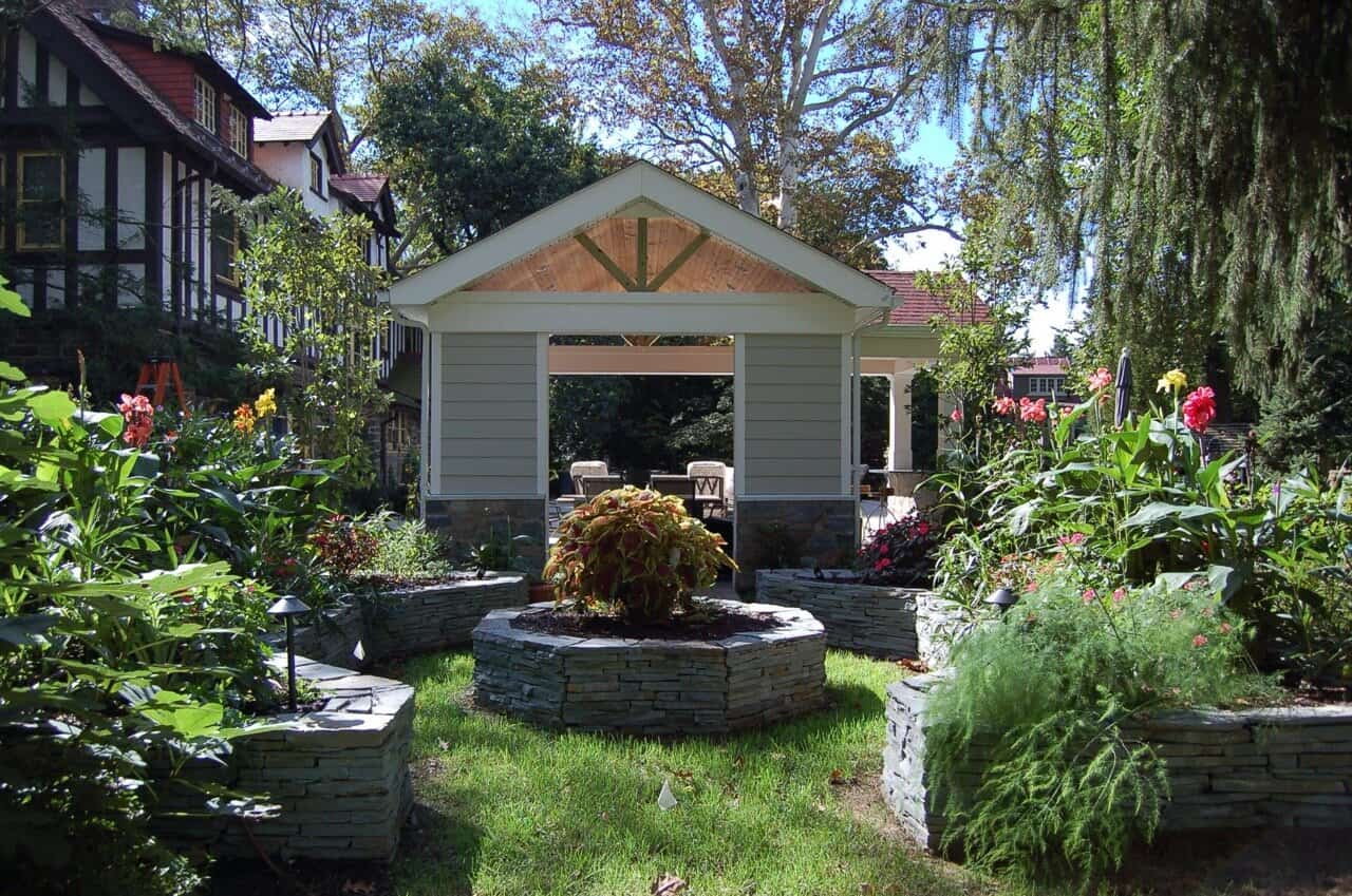 Gardens-Natural-Stone-Walls Stone wall garden space with roof structure designed and built by CKC Landscaping West Chester, Pa