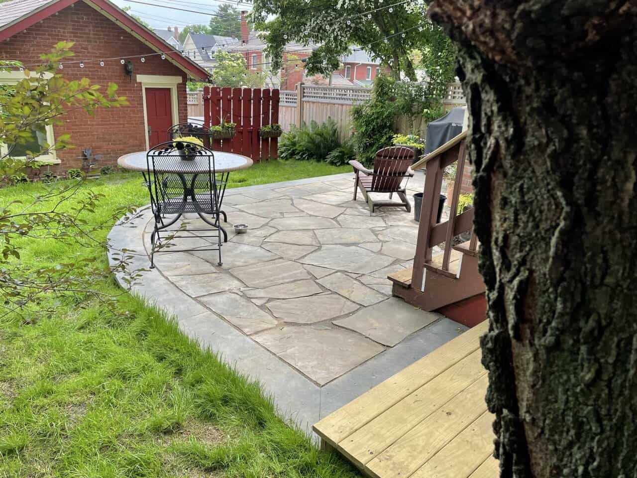 Kennett-Borough-Backyard-Makeover Small private courtyard natural stone patio design in Kennett Square Borough
