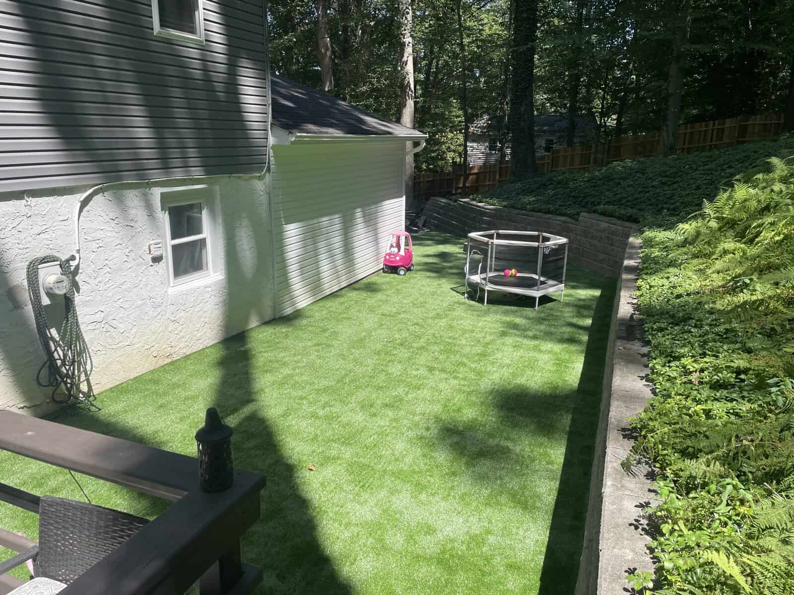 Artificial-Turf-Installation-Chester-County Artificial turf in rear yard replaces regular turf installed by CKC Landscaping