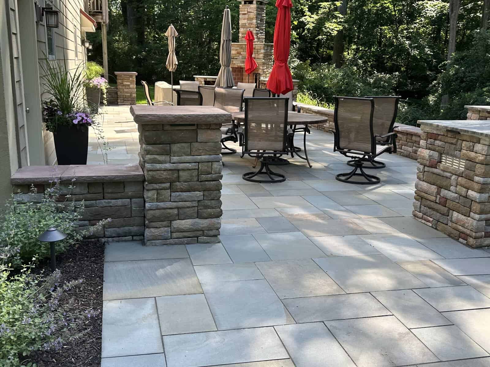 Natural-Flagstone-Patio-Project flagstone patio with stone sitting wall in Downingtown