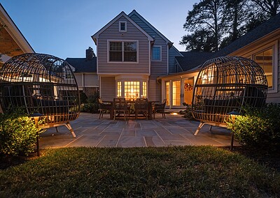 Estate home in Chadds Ford illuminated by architectural up-lighting and path lights