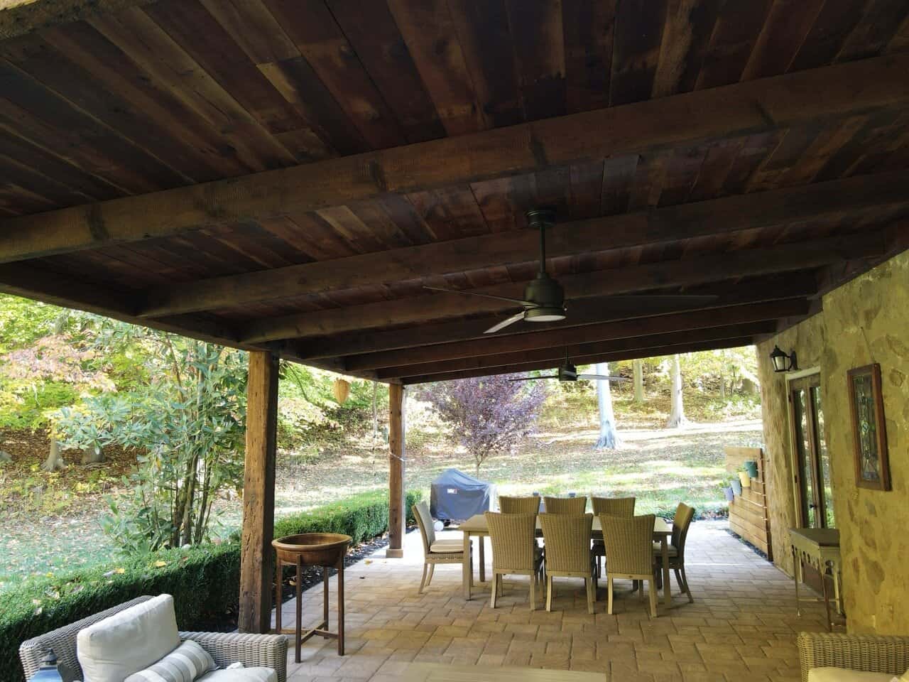 Reclaimed-Barnwood-Covered-Patio Reclaimed barnwood roof structure with metal roof over small paver patio in West Chester