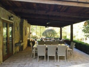 Barnwood Roof and paver patio installation complementing a historic stone farmhouse in Chadds Ford PA