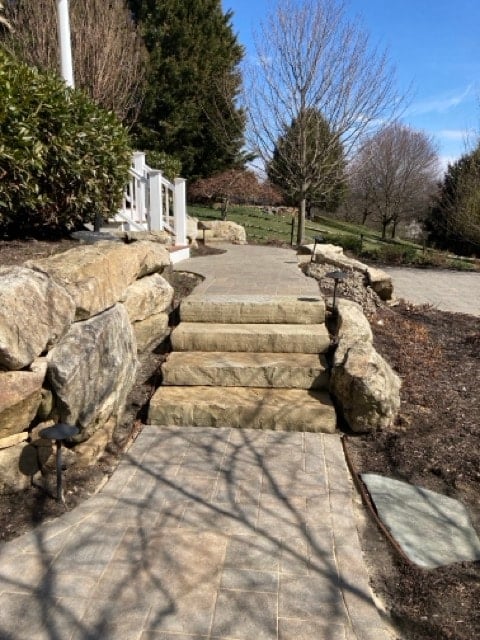 After paver patio restoration and enhancement in West Chester PA showing moss removal and joint sand replacement.