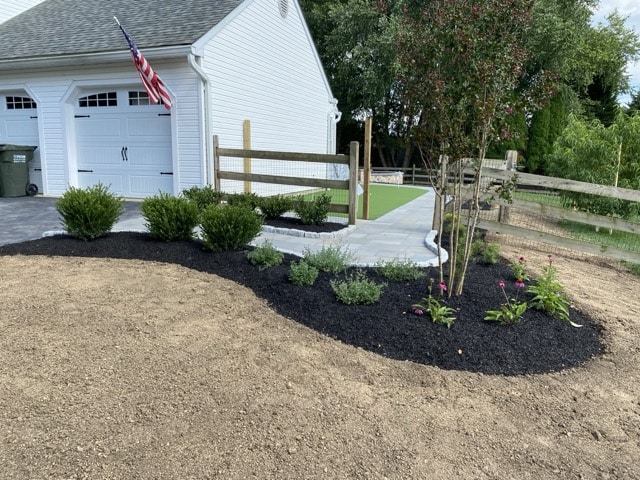 Thermal flagstone walkway with custom artificial turf putting green in Kennett Square PA.