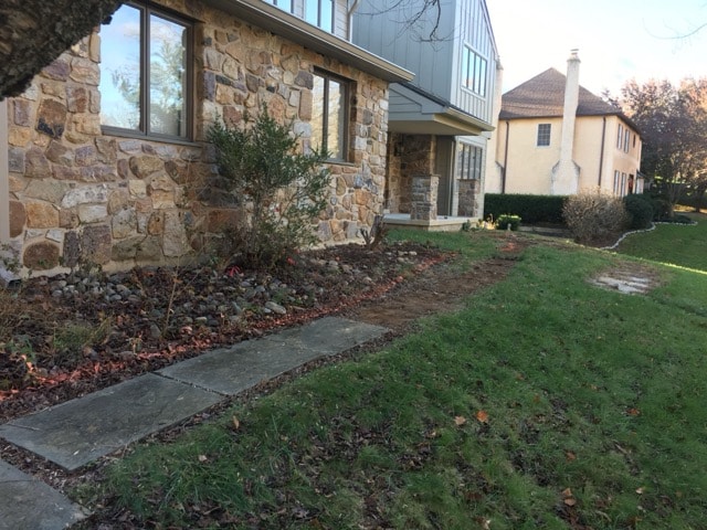 Full color thermal flagstone walkway with 6x6 paver sailor course border in West Chester PA.