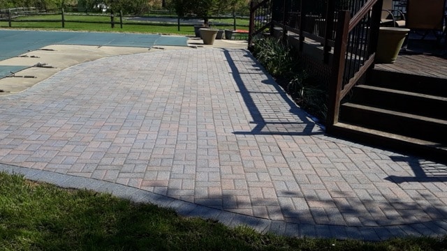 After paver patio restoration and enhancement in West Chester PA showing moss removal and joint sand replacement.