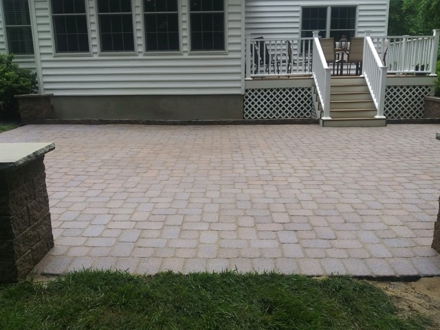 After paver patio restoration and enhancement in West Chester PA showing moss removal and joint sand replacement.