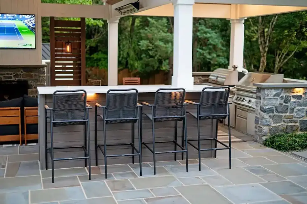 CKC Landscaping Hero Image Luxury outdoor kitchen with built-in grill in Swarthmore Pennsylvania.