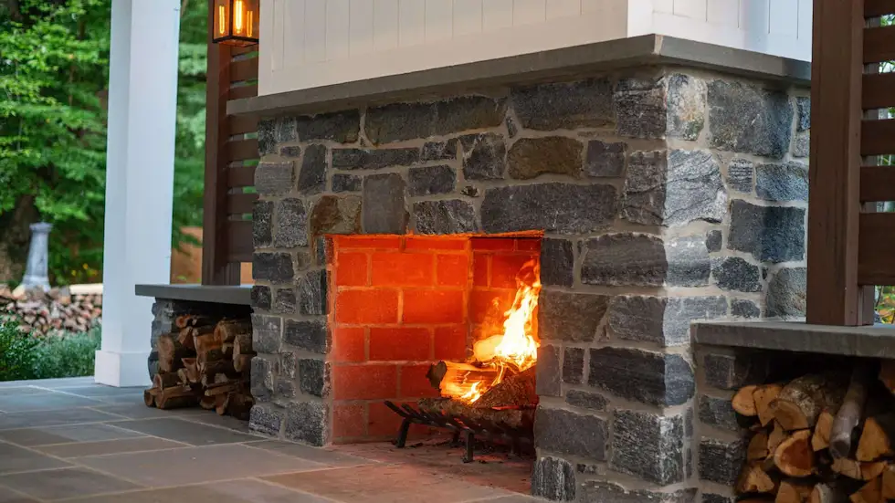 Outdoor-Fireplace-Installation-PA Custom stone fireplace with wood side boxes