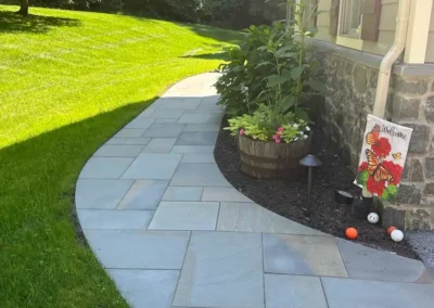 Full Color thermal flagstone installation dry laid front walkway leading to front entrance