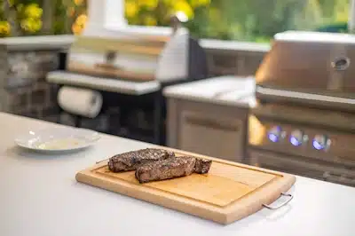 Ultimate-Outdoor-Kitchen-Area Complete outdoor kitchen area with grill, bar seating, and stone veneer in Kennett Square PA