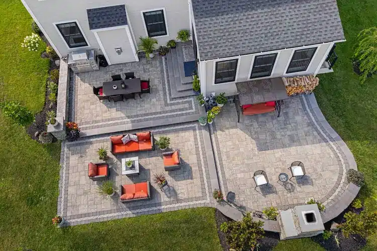 Paver Patio with decorative border by CKC Landscaping 5 To round out your homepage gallery, this specific metadata targets the "High-End Hardscaping" market. Using Belgard as a keyword is a smart move—it’s a premium brand that high-intent customers search for by name.Image 14: Premium Belgard Outdoor Living SpaceFieldSEO-Optimized ContentAlt TextMulti-level Belgard paver patio with decorative borders and stone sitting walls.