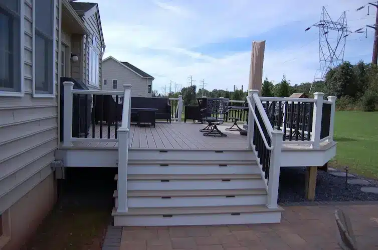 Trex deck and paver patio by CKC Landscaping 8 Custom outdoor deck with paver patio for fall entertaining.